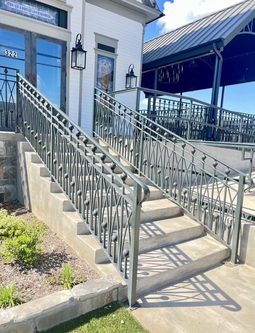 A set of stairs with metal railings on each side.