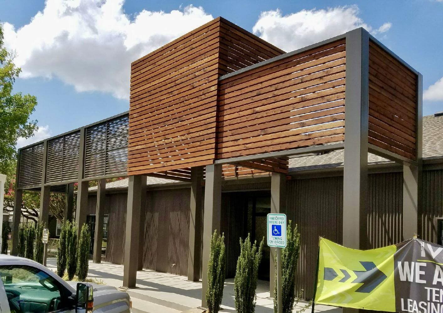 A building with wooden slats on the side of it.